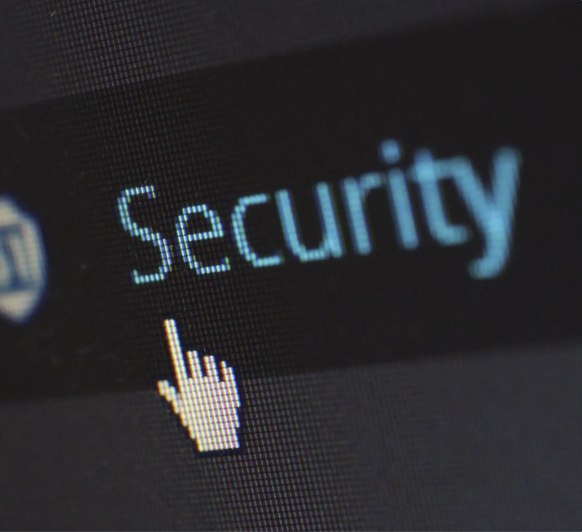 A photo of a mouse cursor hovering over the word security.